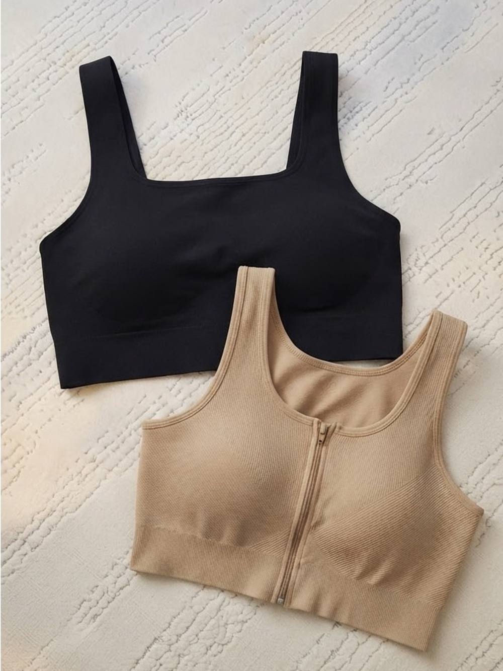 2-piece seamless crop top and bra set in classic black and neutral nude.